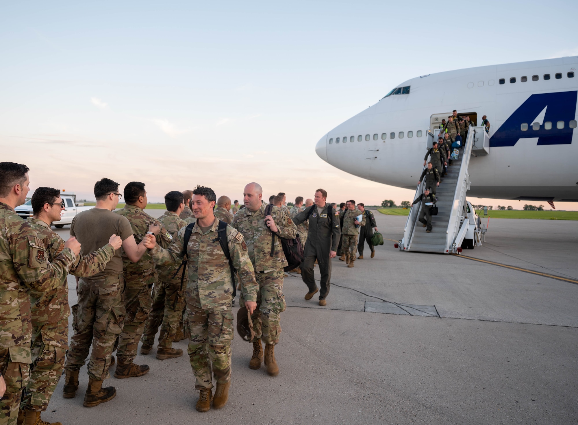 U.S. Airmen assigned to the 5th Bomb Wing return from Bomber Task Force 24-3 at Minot Air Force Base, North Dakota, June 26, 2024. The Airmen spent six weeks at Royal Air Force Fairford, England, as part of a routine deployment to the U.S. Air Forces Europe – Air Forces Africa area of responsibility. (U.S. Air Force photo by Airman 1st Class Luis Gomez)
