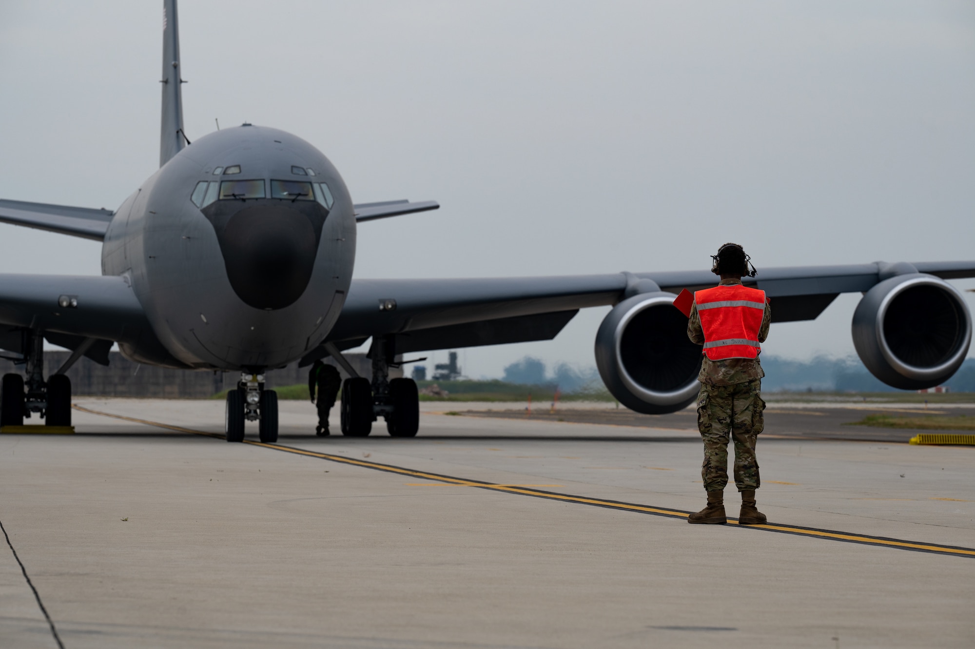 person standing by KC-135