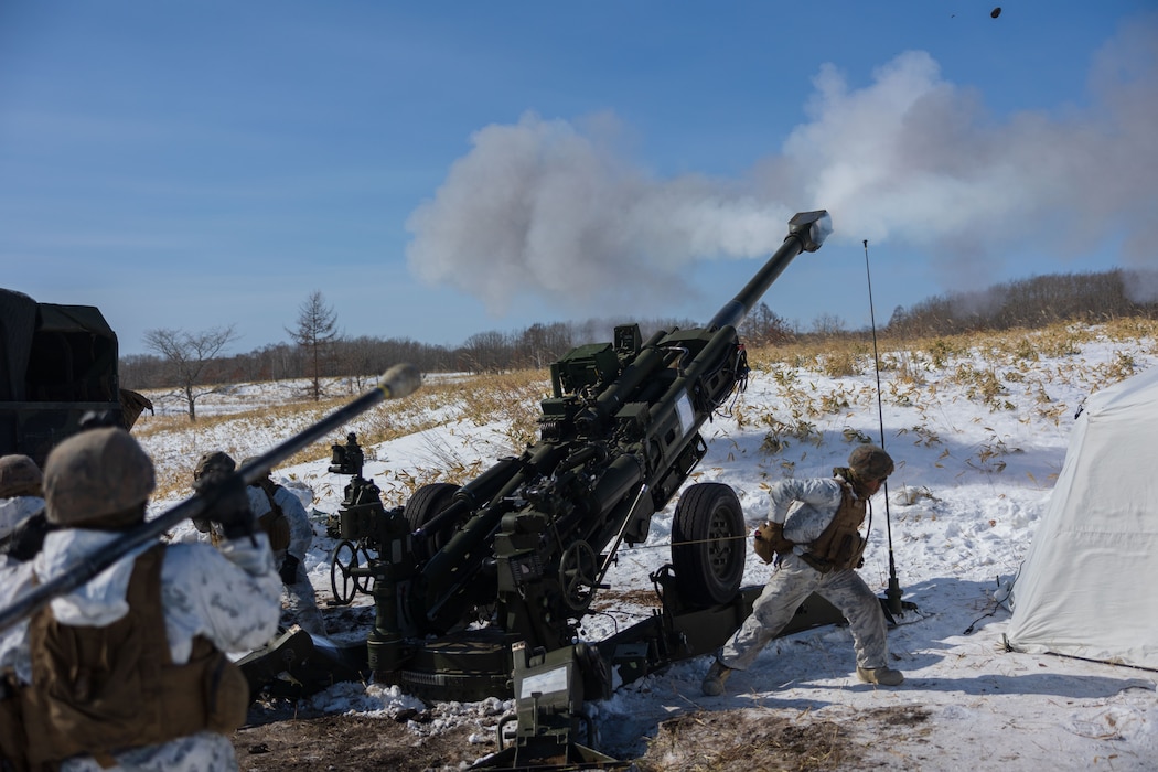 U.S. Marines fire an M777 howitzer during Artillery Relocation Training Program 23.4 at Yausubetsu Maneuver Area, Hokkaido, Japan, Feb. 29, 2024. The skills developed at ARTP increase the proficiency and readiness of the only permanently forward-deployed artillery unit in the Marine Corps, enabling them to provide precision indirect fires. The Marines are with 3d Battalion, 12th Marine Littoral Regiment, 3d Marine Division. (U.S. Marines Corps photo by Cpl. Jaylen Davis)