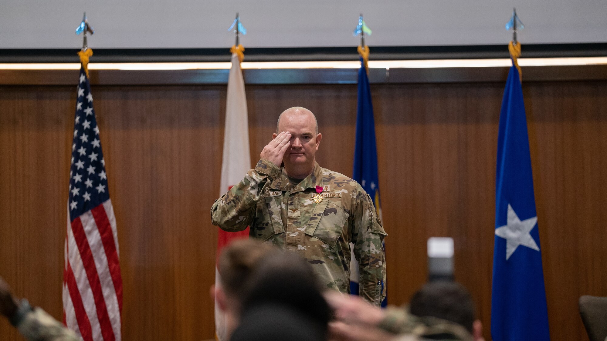 outgoing 18th MDG commander gives final salute