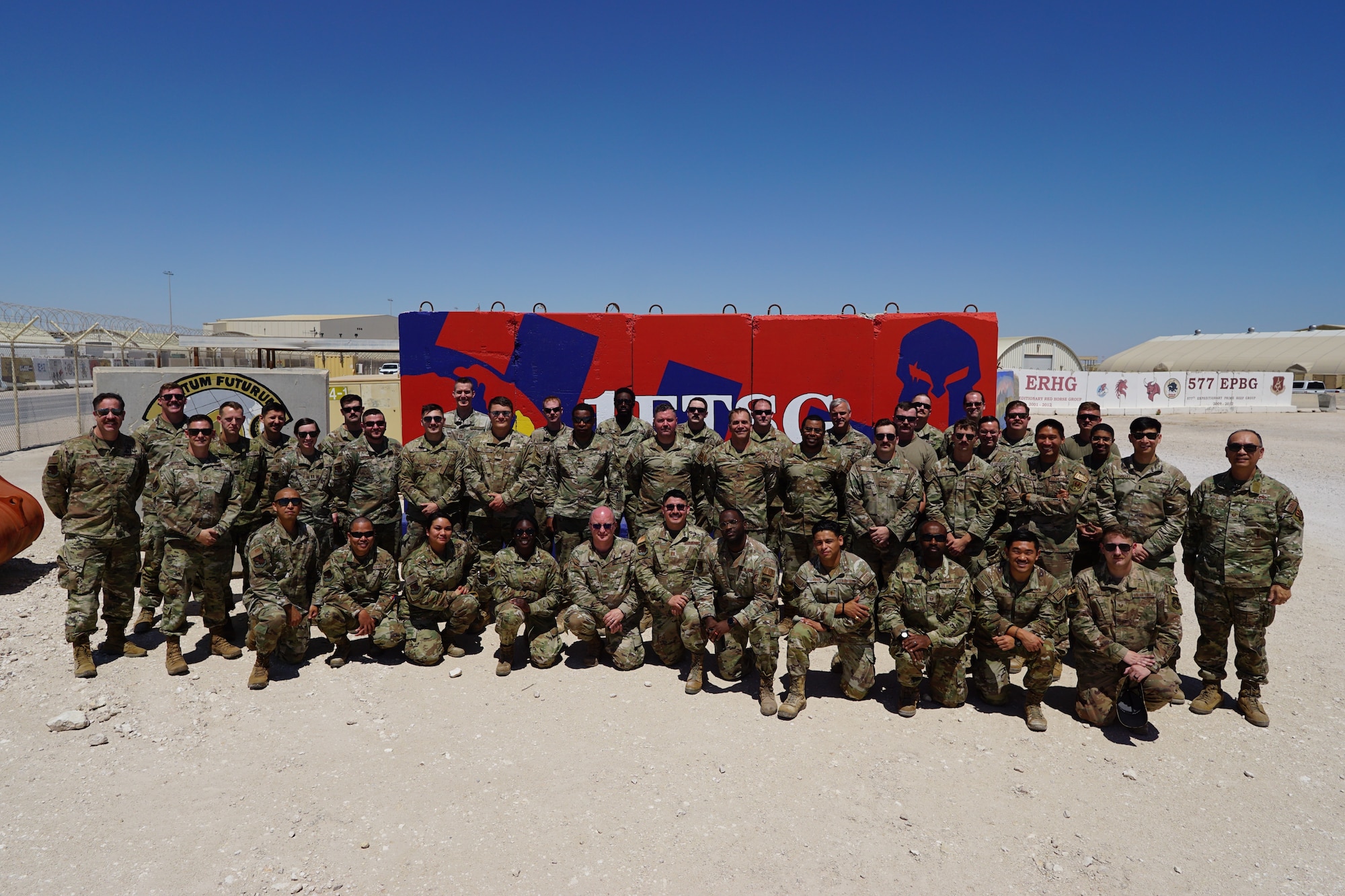 Airmen assigned to the 1st Expeditionary Theater Support Group pause for a group photo at an undisclosed location within the U.S. Central Command area of responsibility, March 27, 2023. The ETSG’s main priorities are setting the theater, supporting the theater, long-term posture of the theater, and innovation for the theater. (U.S. Air Force Courtesy photo)