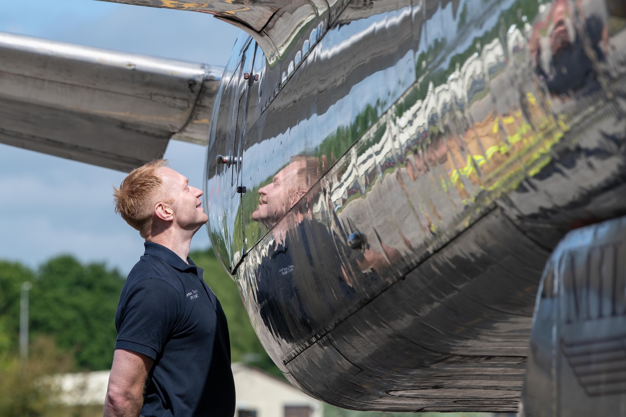 A Pathfinder smiles during a tour of a Douglas A-26C Invader