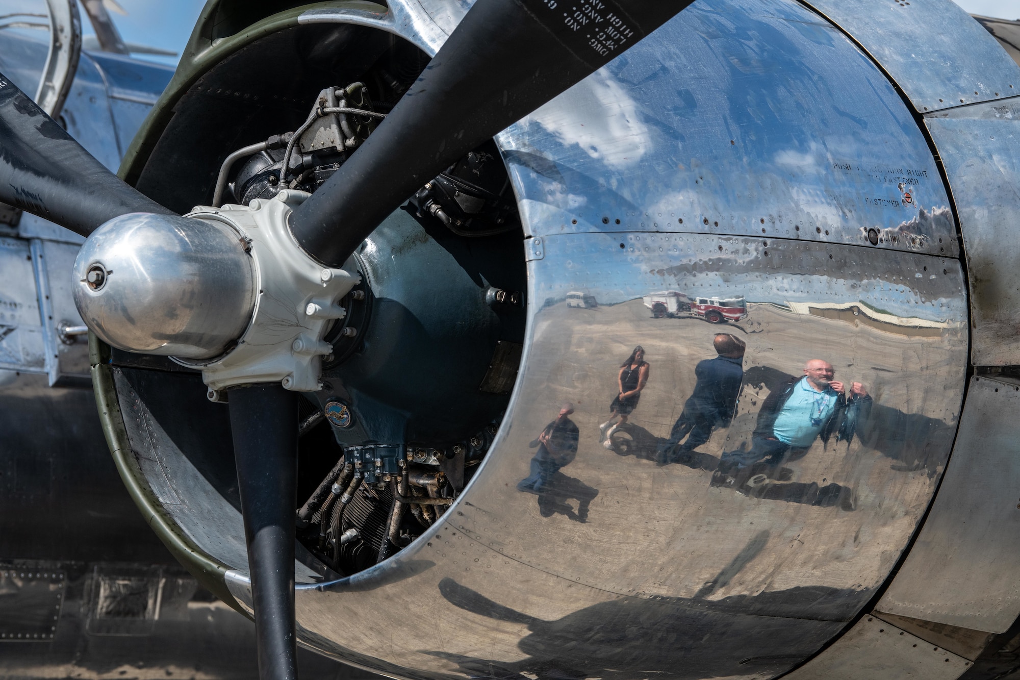 A reflection of Pathfinders touring a Douglas A-26C Invader