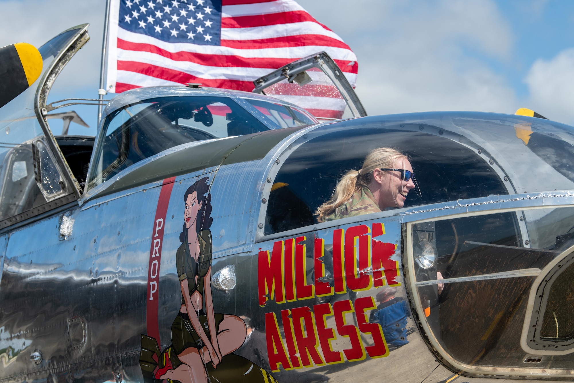A Pathfinder smiles during a tour of a Douglas A-26C Invader