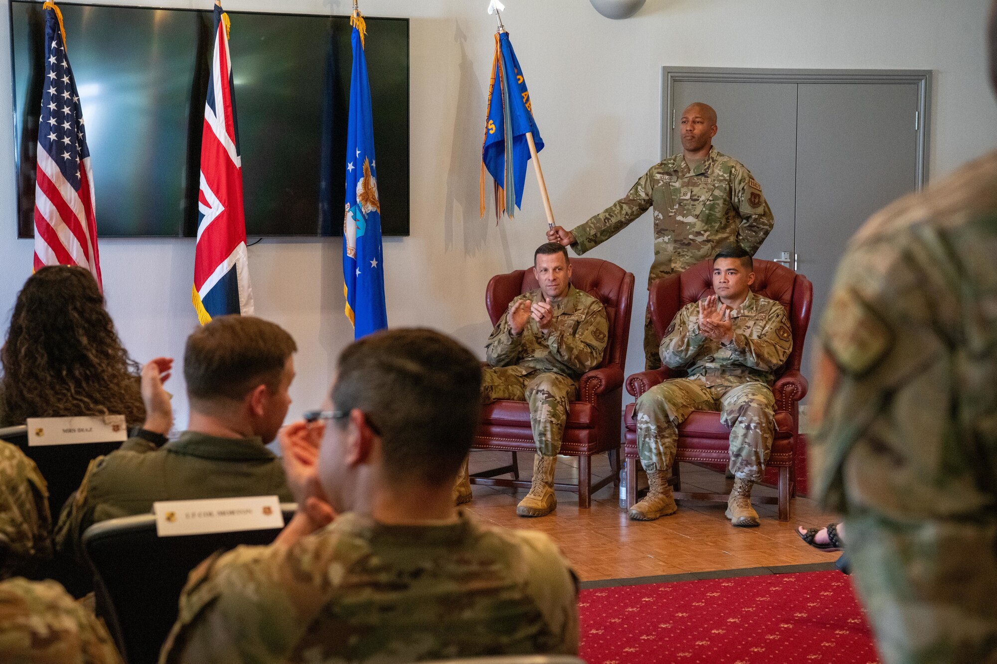 Airmen applaud during the 422nd SFS assumption of command ceremony