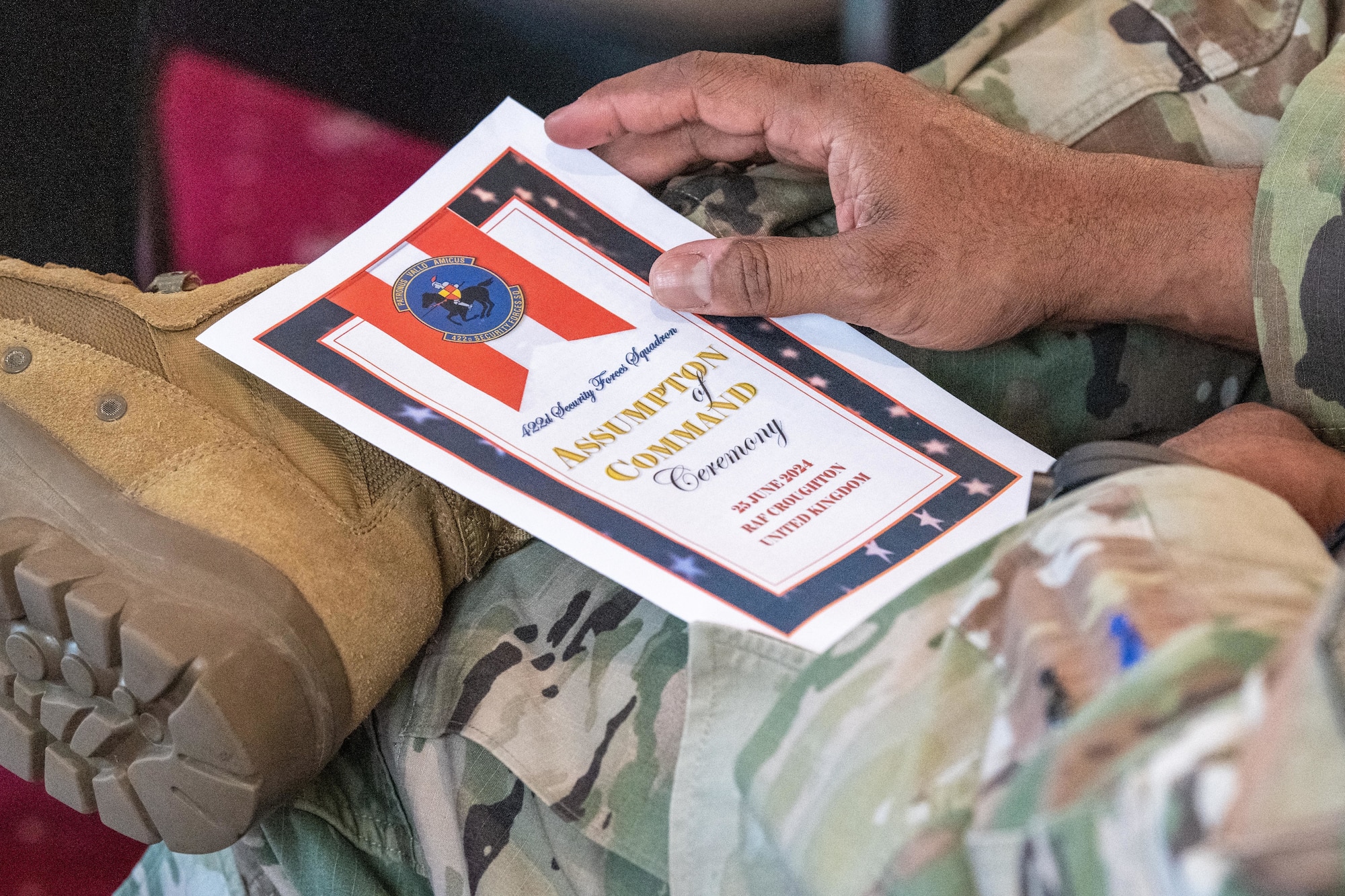 A program for the 422nd Security Forces Squadron assumption of command ceremony is held