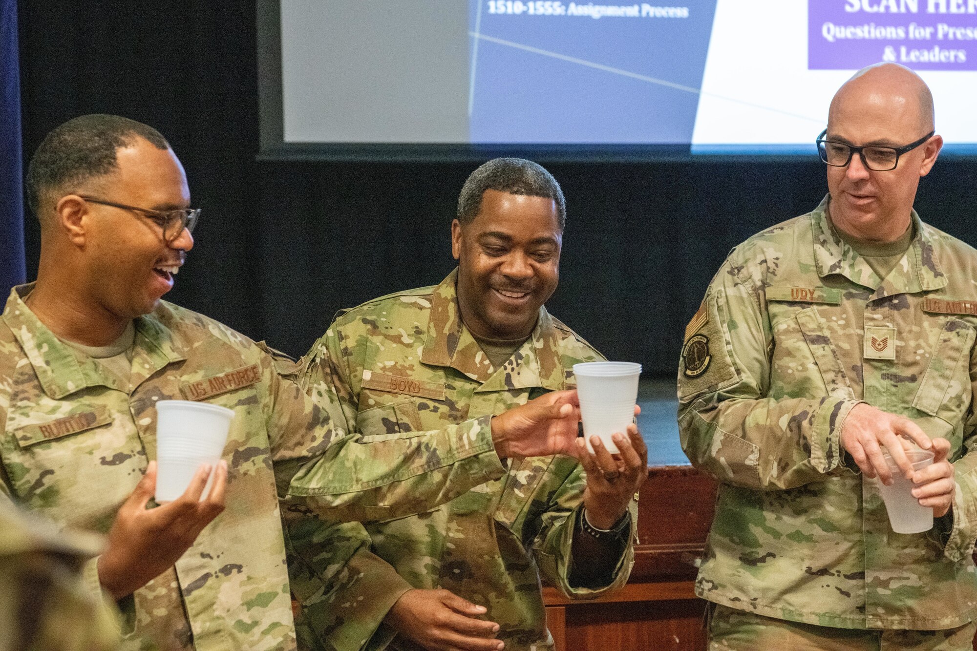 Airmen participate in an ice-breaker activity during a senior leadership professional development seminar