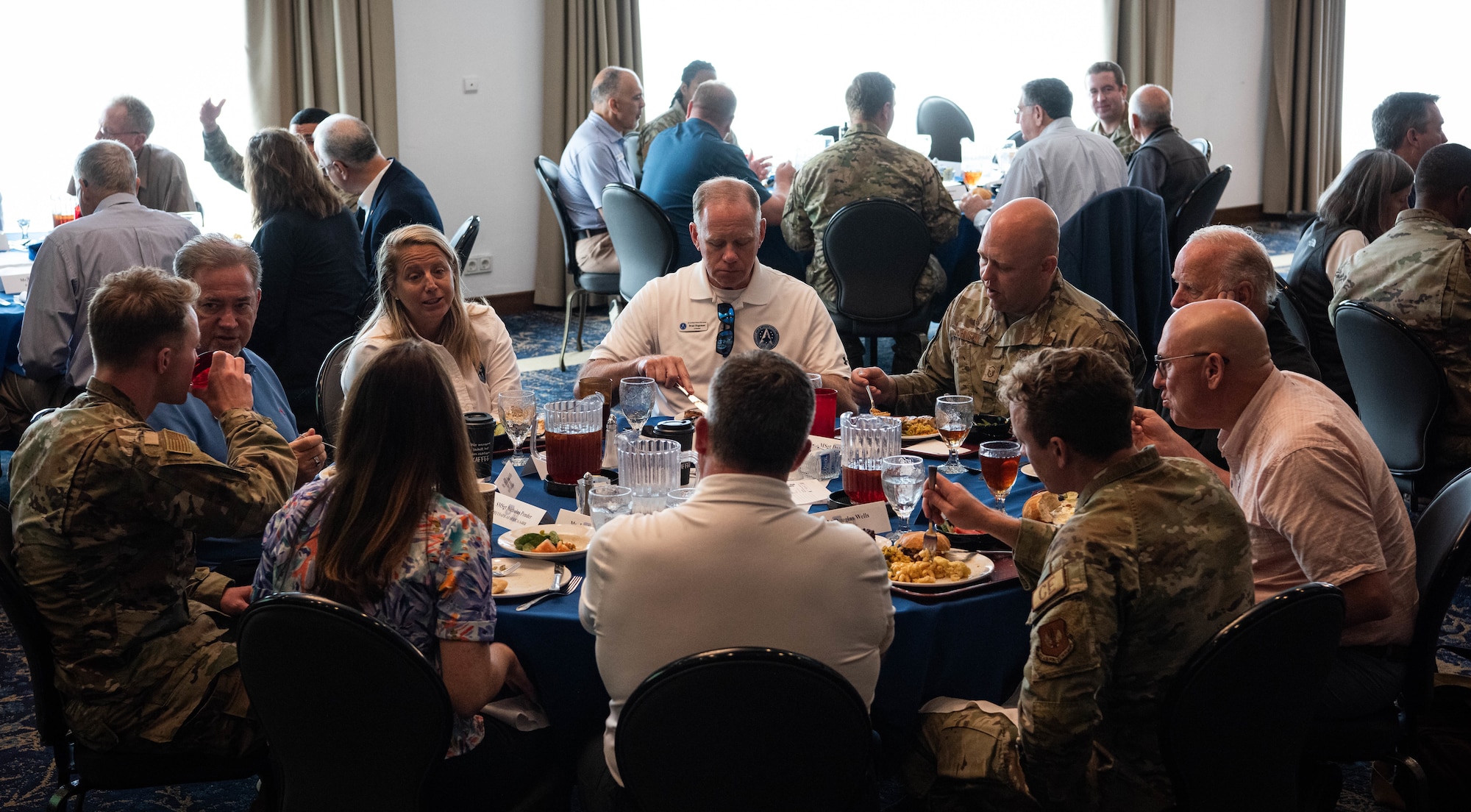 U.S. Air Force Airmen eat lunch with members of the Air and Space Forces civic leader group during an immersion at Ramstein Air Base, Germany, June 24, 2024. The civic leader group hosted the lunch in order to hear about experiences of Airmen. The civic leader group engaged in a multi-day tour across U.S. Air Forces in Europe – Air Forces Africa bases to receive valuable familiarization and education on USAFE-AFAFRICA missions, future initiatives, and command priorities. (U.S. Air Force photo by Senior Airman Jared Lovett)