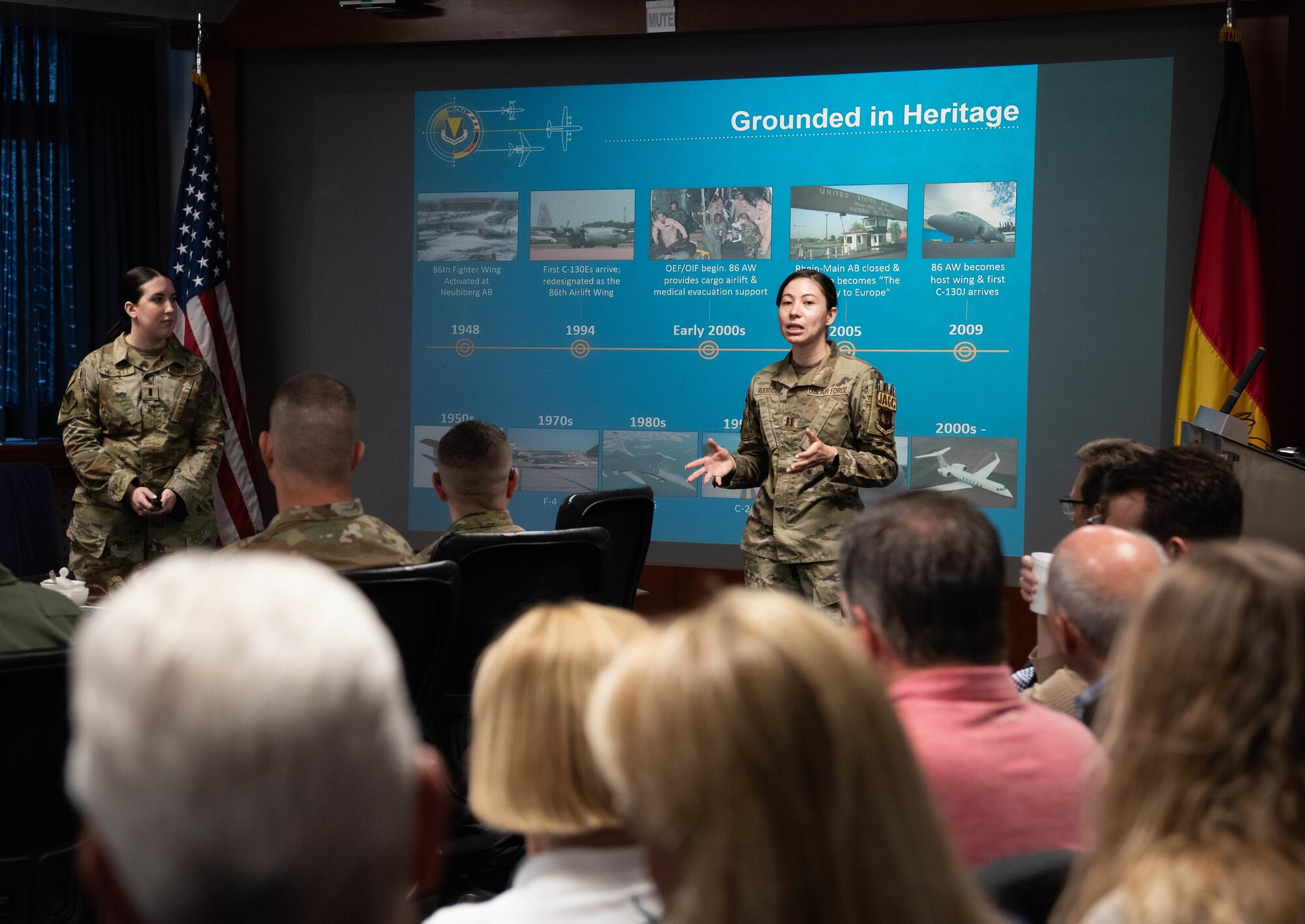 U.S. Air Force Capt. Wilma Rodriguez, 86th Airlift Wing Judge Advocates Office chief of non-judicial punishments, provides a 86th AW mission brief to members of the Air and Space Forces civic leader group during an immersion at Ramstein Air Base, Germany, June 25, 2024. Civic leaders provide ideas and feedback to advise the Secretary of the Air Force, Air Force Chief of Staff, Chief of Space operations and other senior leaders about how missions can best be accomplished in their respective areas and about public attitudes toward Air and Space Force’s activities. The civic leader group engaged in a multi-day tour across U.S. Air Forces in Europe – Air Forces Africa bases to receive valuable familiarization and education on USAFE-AFAFRICA missions, future initiatives, and command priorities. (U.S. Air Force photo by Senior Airman Jared Lovett)