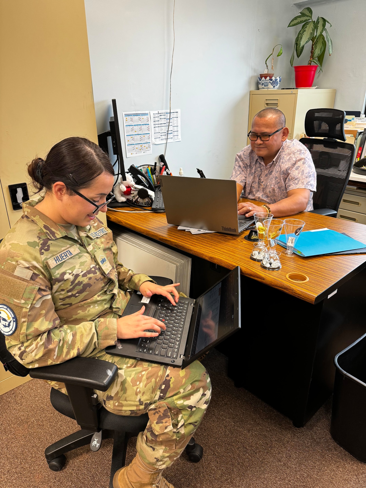Specialist 4 Kaylah Huerta, 68th Cyber Squadron, Schriver Space Force Base, Schriever Space Force Base, Colorado, works on asset mapping with an employee from Guam Homeland Security as part of the Innovative Readiness Training (IRT) cybersecurity event on Guam June 4 to 14. All IRT missions are dual-hatted as a community service and an opportunity for servicemembers to receive real-world training they may not receive at their home units. (U.S. Air Force courtesy photo)