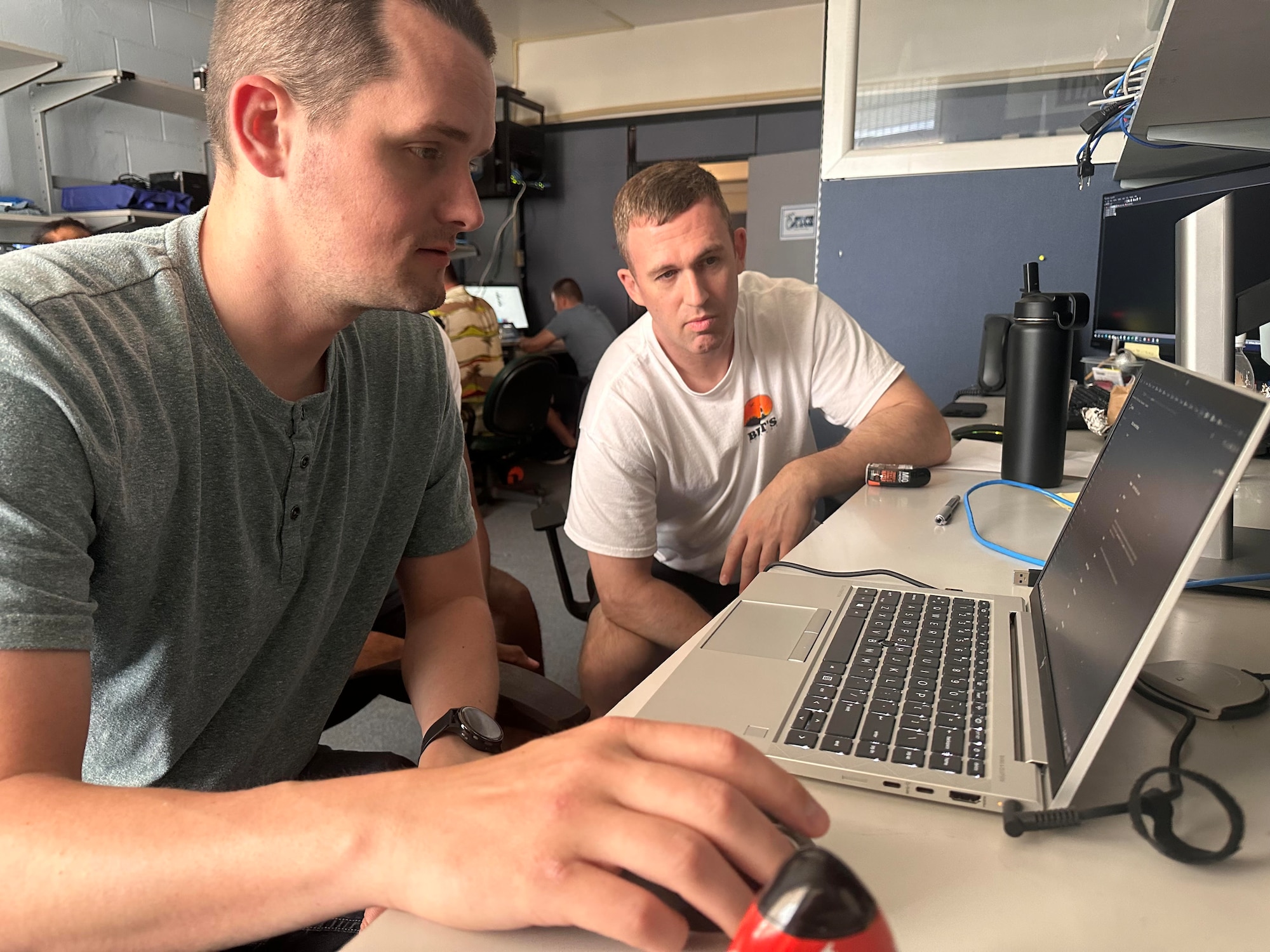 Master Sergeant Colby Teafatiller, 53rd  Network Operations Squadron, Peterson Space Force Base, Colorado and Technical Sergeant Forrest Zimmermann, 51st Network Operations Squadron, Langley AFB, Virginia, work on Guam’s cybersecurity infrastructure as part of the Innovative Readiness Training (IRT) cybersecurity event on Guam June 4 to 14. All IRT missions are dual-hatted as a community service and an opportunity for servicemembers to receive real-world training they may not receive at their home units. (U.S. Air Force courtesy photo)