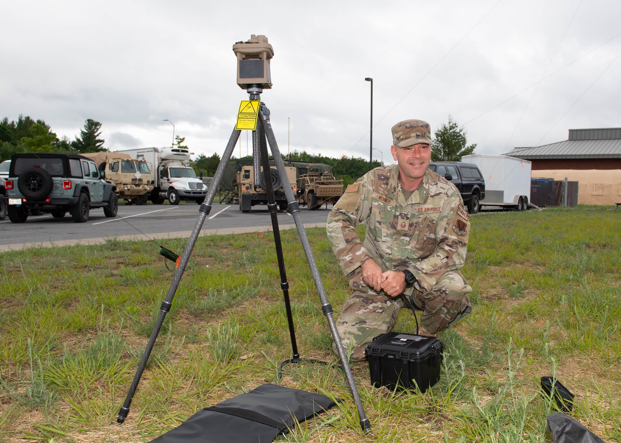 Master Sgt. Ken Wenner sets up and utilizes a micro weather automated observation system and handheld multi-capable weather sensor to keep tabs on weather conditions for Exercise Iron Keystone 2024 components occurring at Fort Drum, N.Y.