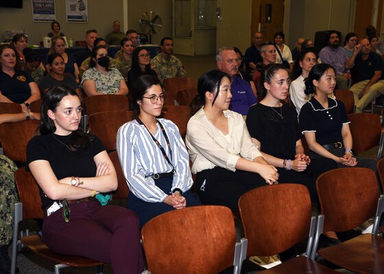 JOINT BASE SAN ANTONIO-FORT SAM HOUSTON – (June 27, 2024) – Naval Research Enterprise Internship Program (NREIP) interns were hailed during Naval Medical Research Unit (NAMRU) San Antonio’s All Hands meeting held at the Military and Family Readiness Center. NREIP places college and university students in Department of Navy (DoN) laboratories where they take part in real Naval research for ten weeks during the summer. NAMRU San Antonio is one of the leading research and development laboratories for the U.S. Navy under the Department of Defense (DoD) and is one of eight subordinate research commands in the global network of laboratories operating under the Naval Medical Research Command in Silver Spring, Md.  Its mission is to conduct gap driven combat casualty care, craniofacial, and directed energy research to improve survival, operational readiness, and safety of DoD personnel engaged in routine and expeditionary operations. (U.S. Navy photo by Burrell Parmer, NAMRU San Antonio Public Affairs/Released)