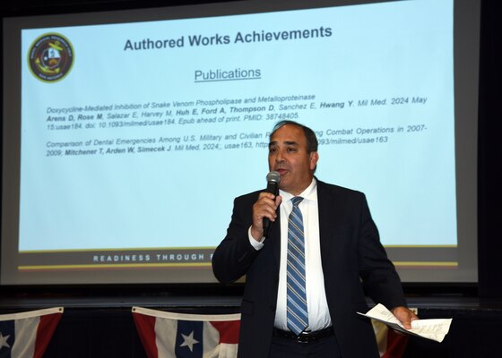 JOINT BASE SAN ANTONIO-FORT SAM HOUSTON – (June 27, 2024) – Chief Science Director Dr. Darrin Frye of Naval Medical Research Unit (NAMRU) San Antonio recognized research scientist for their published works to include podium and poster presentations during an All Hands meeting at the Military and Family Readiness Center.  NAMRU San Antonio’s mission is to conduct gap driven combat casualty care, craniofacial, and directed energy research to improve survival, operational readiness, and safety of Department of Defense (DoD) personnel engaged in routine and expeditionary operations. It is one of the leading research and development laboratories for the U.S. Navy under the DoD and is one of eight subordinate research commands in the global network of laboratories operating under the Naval Medical Research Command in Silver Spring, Md. (U.S. Navy Photo by Burrell Parmer, NAMRU San Antonio Public Affairs/Released)