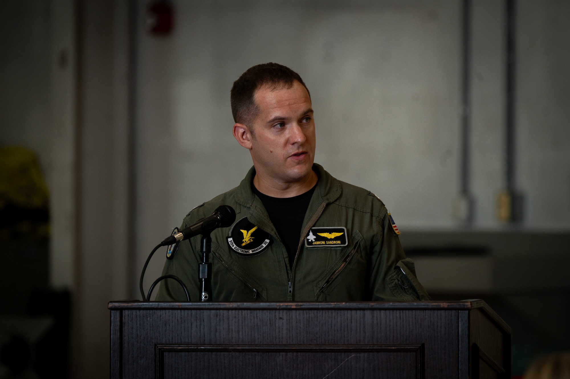 U.S. Navy Cmdr. Alexander Sandroni, 513th Electronic Warfare Squadron commander, provides his first remarks as squadron commander during the 513th EWS change of command ceremony at Eglin Air Force Base, Florida, June 18, 2024. The 513th EWS is made up of U.S. Air Force, U.S. Navy, and Marine Corps military, civilian, and contractor personnel spread across six flights. (Courtesy Photo)