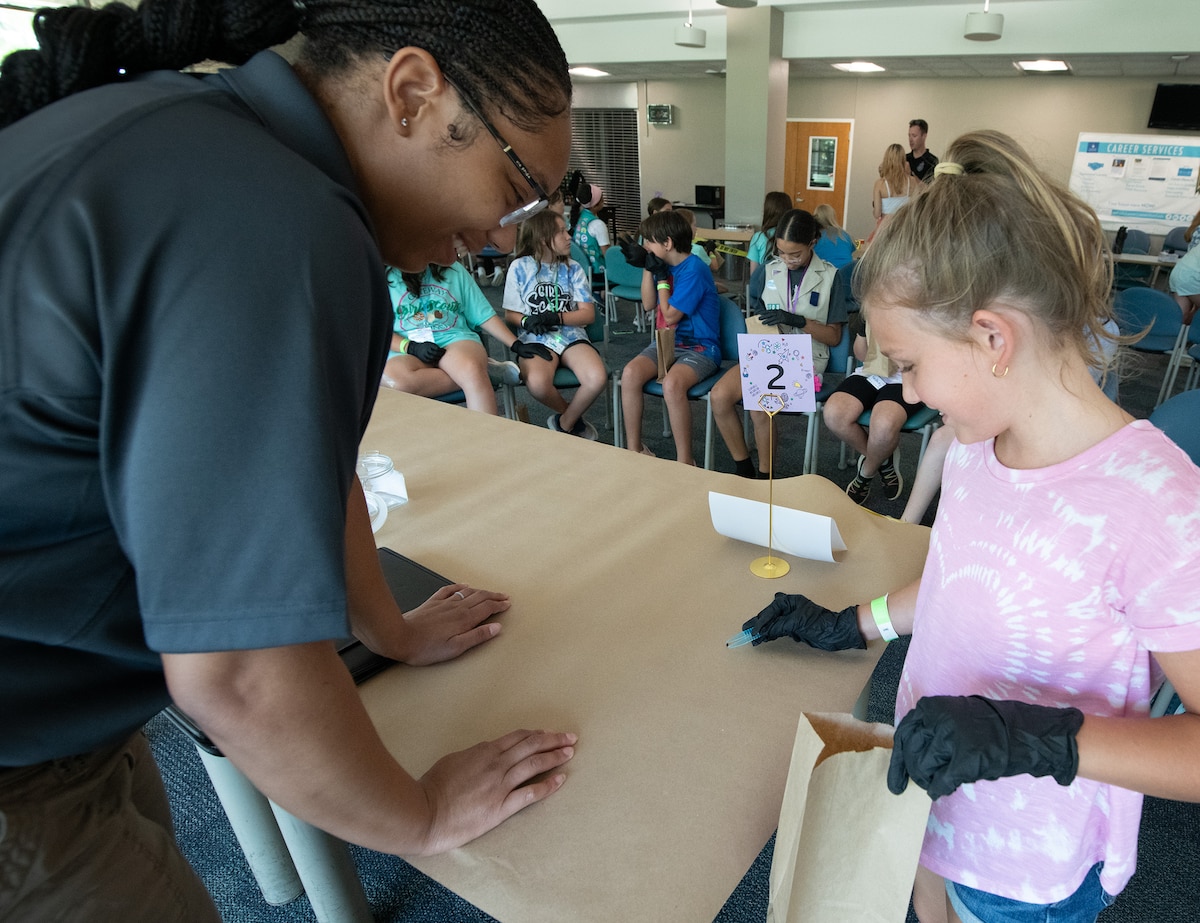 Girl Scouts of Gateway Council participate in a Girl Scout crime scene activity as part of STEM Day Camp.