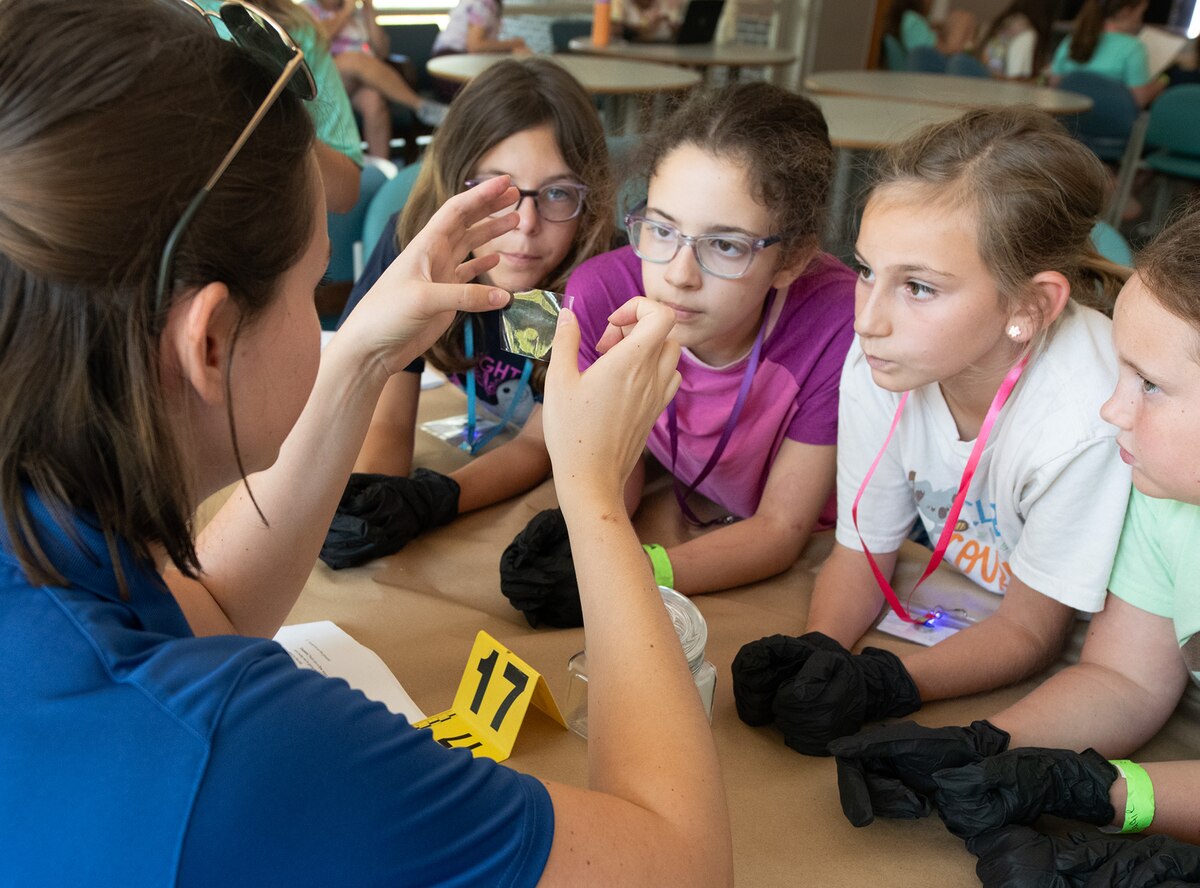Girl Scouts of Gateway Council participate in a Girl Scout crime scene activity as part of STEM Day Camp.