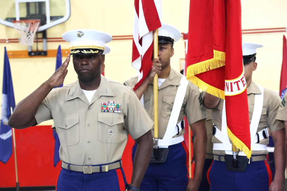 Military and civilian employees bid farewell and following seas to Colonel Gregory Pace while welcoming aboard Col. Russell Savatt IV during the Change of Command 2024 ceremony at Marine Corps Logistics Base Barstow, California, June 26.