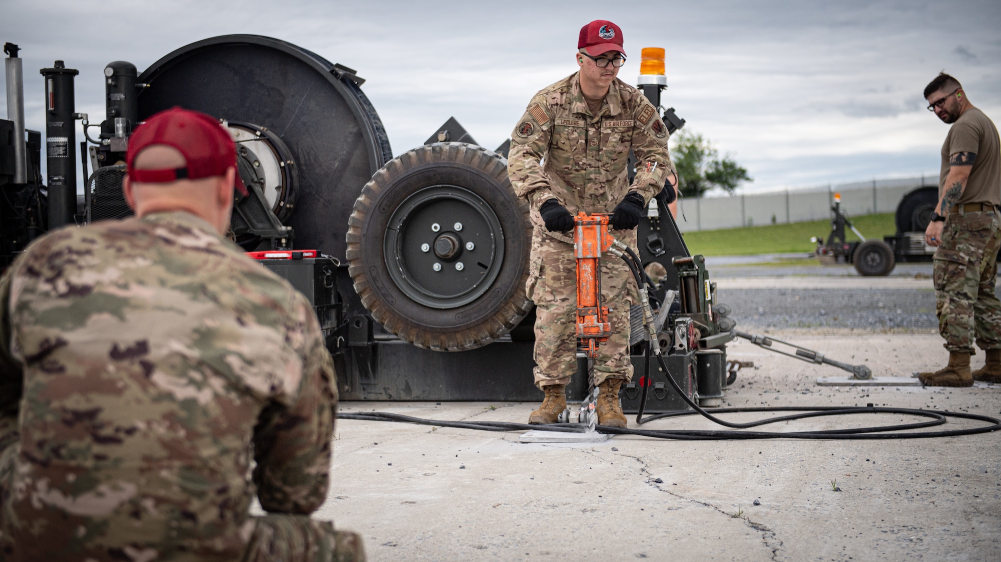 Airmen from the 201st RED HORSE Squadron set up a mobile aircraft arresting system during Pennsylvania Air National Guard exercise Iron Keystone 24 at Fort Indiantown Gap, Pennsylvania, June 9, 2024.