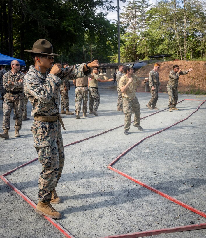 U.S. service members prepare for in the 63rd annual Interservice Rifle Competition, hosted by the Civilian Marksmanship Program, on Marine Corps Base Quantico, Virginia, June 24, 2024. The mission of the CMP is to promote marksmanship through firearms training and safety programs and competitions. (U.S. Marine Corps photo by Lance Cpl. Jeffery Stevens)