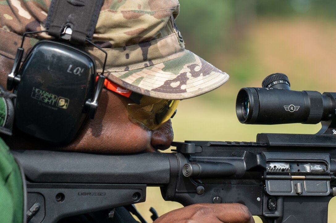 U.S. Army Sgt. 1st Class Lawrence Carter, native of Kalamazoo, Minnesota, stationed with 7th Transportation Brigade, fires at his target point during the 63rd annual Interservice Rifle Competition, hosted by the Civilian Marksmanship Program on Marine Corps Base Quantico, Virginia, June 26, 2024. This day covers matches 1-6 of the championship in which competitors shoot in different positions at varying distances away from their target to test their accuracy and precision at any length or circumstance. The mission of the CMP is to promote marksmanship through firearms training and safety programs and competitions. (U.S. Marine Corps photo by Cpl. Keahi J. Soomanstanton)