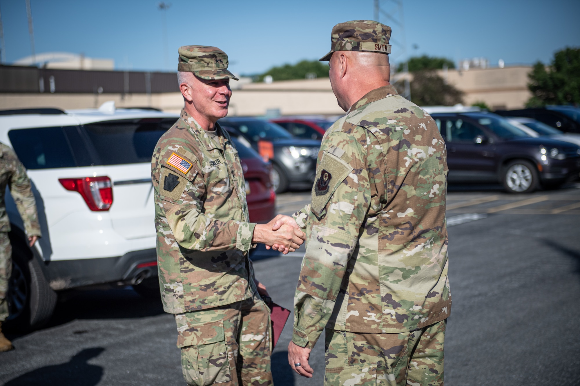 Chief Master Sgt. Robert Smith, 193rd Special Operations Wing command chief, greets U.S. Army Maj. Gen. Mark Schindler, Adjutant General of Pennsylvania, in Middletown, Pennsylvania, June 7, 2024.
