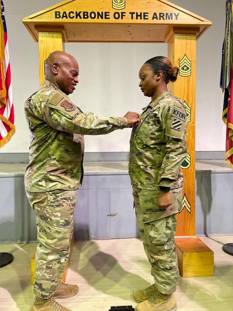 Senior Enlisted Advisor Tony Whitehead, SEA to the chief, National Guard Bureau, promotes his niece to the rank of sergeant first class at Camp Bondsteel, Kosovo, June 24, 2024. Sgt. 1st Class Jasmine Promise, paralegal NCO in charge of the Regional Command East legal office, is deployed to Kosovo with the Georgia National Guard’s 48th Infantry Brigade, supporting the Kosovo Force.