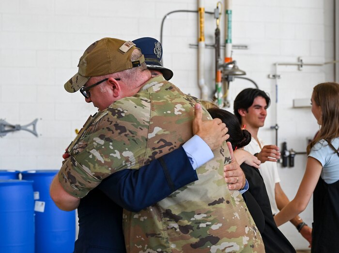 Airmen hug each other