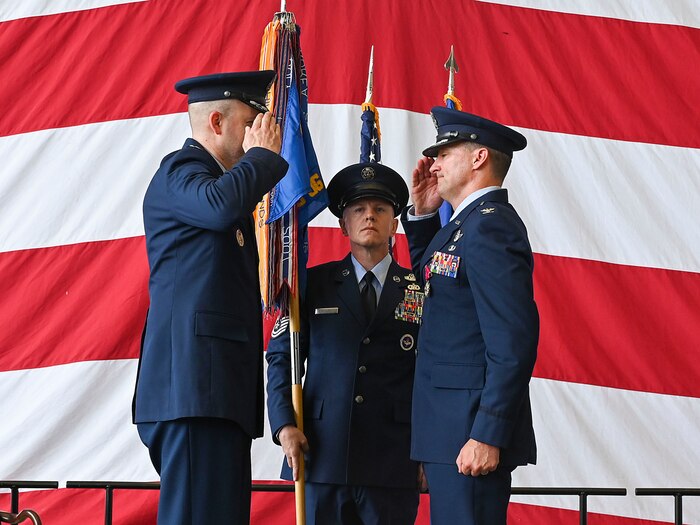 A group commander salutes the wing commander