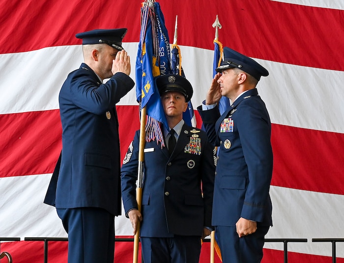 A group commander salutes the wing commander