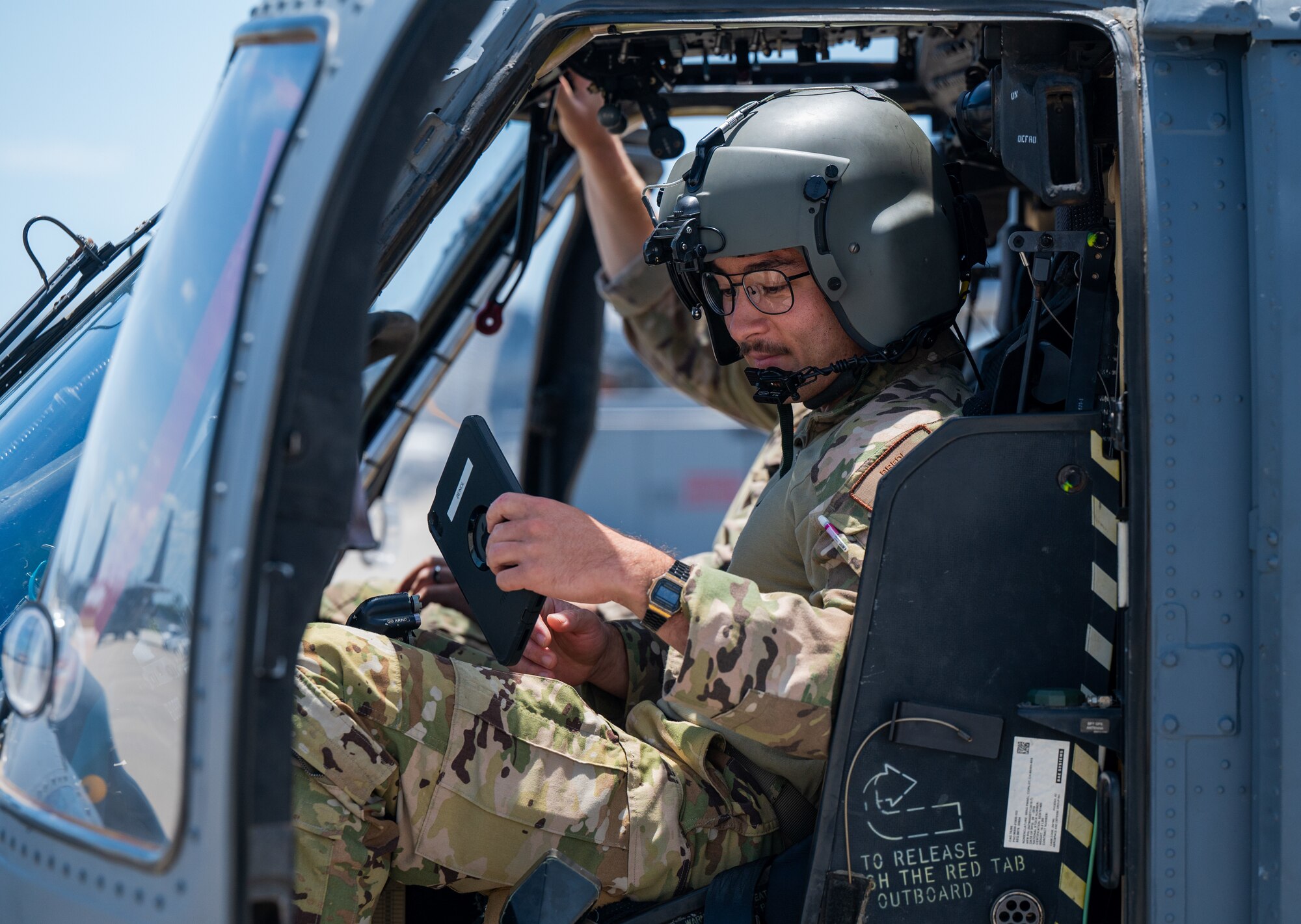 U.S. Air Force Capt. Teague Bredl, 41st Rescue Squadron HH-60W co-pilot from Moody Air Force Base, Georgia, conducts pre-flight operations in a helicopter at Patrick Space Force Base, Florida, June 1, 2024. The team from Moody supported the Atlas V rocket Orbital Crew Flight Test mission, which launched two astronauts from Space Launch Complex 41 on Cape Canaveral Space Force Station, Florida. This was the first time since 1968 astronauts were launched from CCSFS and the first time ever from a Space Force installation. (U.S. Space Force photo by Airman 1st Class Spencer Contreras)