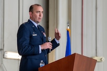 A photo of a man speaking to a crowd.