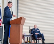 A photo of a man speaking to a crowd.