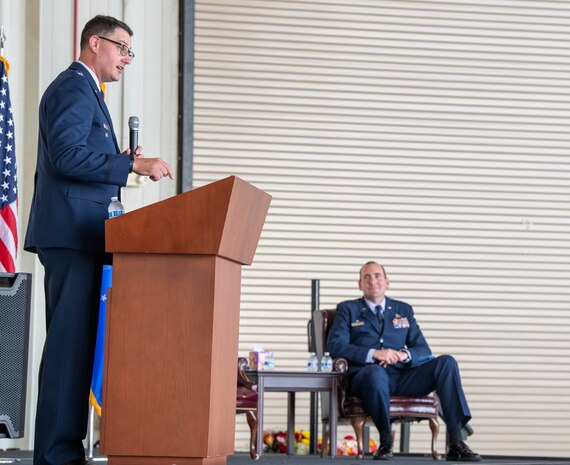 A photo of a man speaking to a crowd.