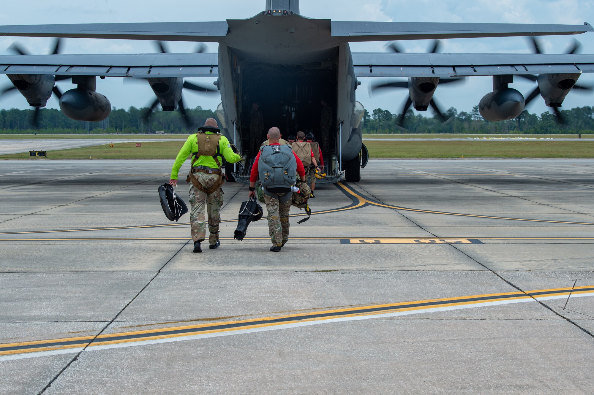 U.S. Air Force Chief Master Sgt. Justin Geers, 23rd Wing command chief, walks towards an HC-130J Combat King II in preparation for a battlefield circulation (BFC) at Moody Air Force Base, Georgia, June 24, 2024. This BFC showcased Airmen’s ability to rapidly deploy to austere environments by parachuting into the water. (U.S. Air Force photo by Airman 1st Class Iain Stanley)