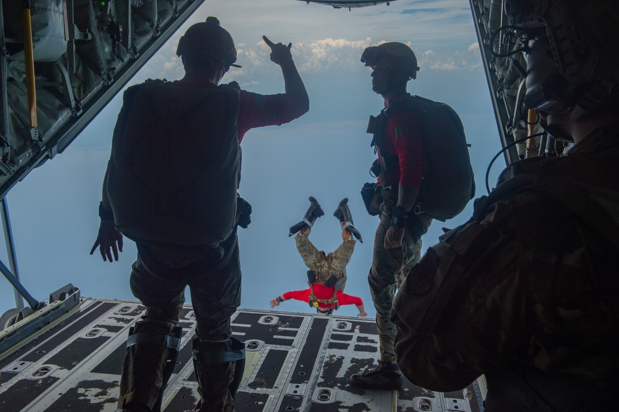 U.S. Air Force pararescuemen assigned to the 38th Rescue Squadron jump out of an HC-130J Combat King II over the Gulf of Mexico, June 24, 2024. The 38th RQS is a vital component of the Air Force's personnel recovery operations, ensuring the safety and recovery of military personnel and civilians in need. (U.S. Air Force photo by Airman 1st Class Iain Stanley)