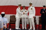 Capt. Vincent Jansen transferred command of Coast Guard Air Station Sitka to Cmdr. Rand Semke. Rear Adm. Megan Dean, commander, Coast Guard Seventeenth District, presided over the ceremony.
