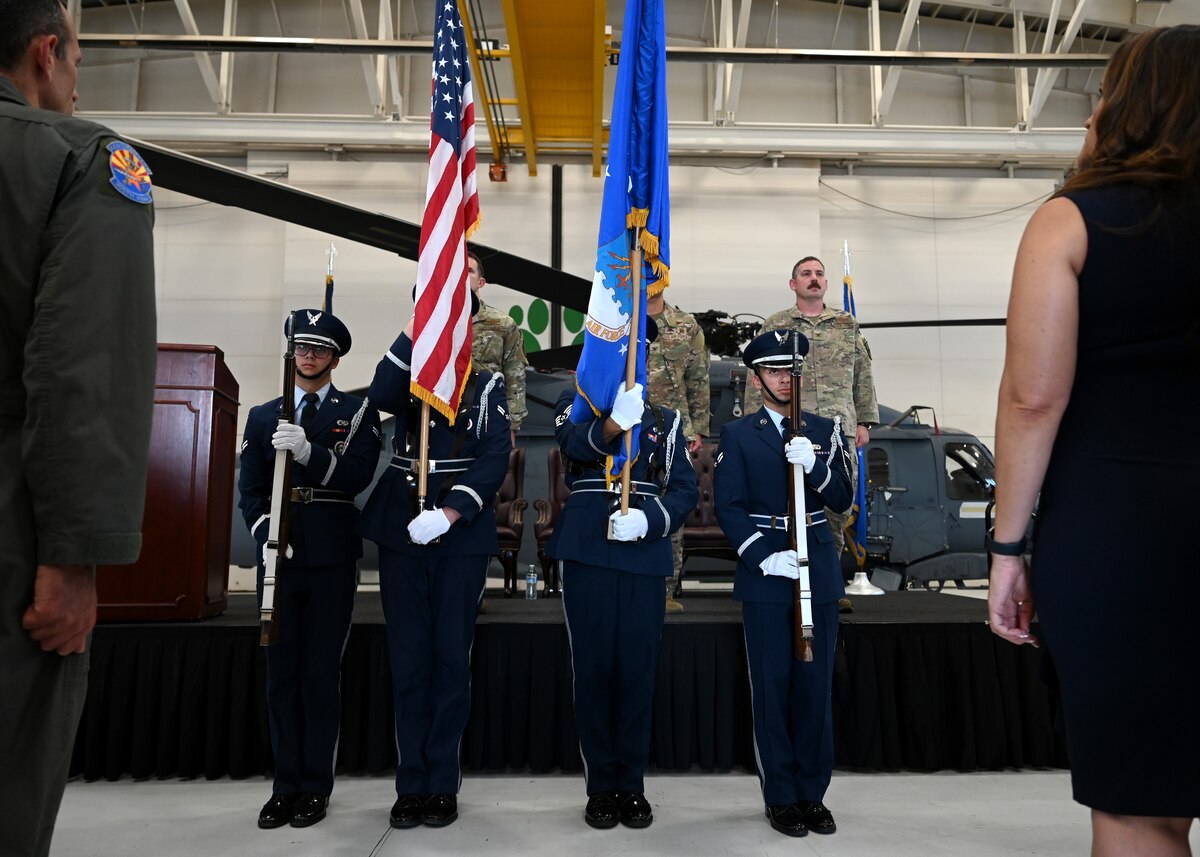 U.S. Airmen assigned to the Davis-Monthan Air Force Base Honor Guard present the colors during the 563rd Rescue Group Change of Command at DMAFB, Ariz., June 28, 2024. The colors, or flags, are posted at a military ceremony marking an anniversary or significant event. (U.S. Air Force photo by Staff Sgt. Abbey Rieves)