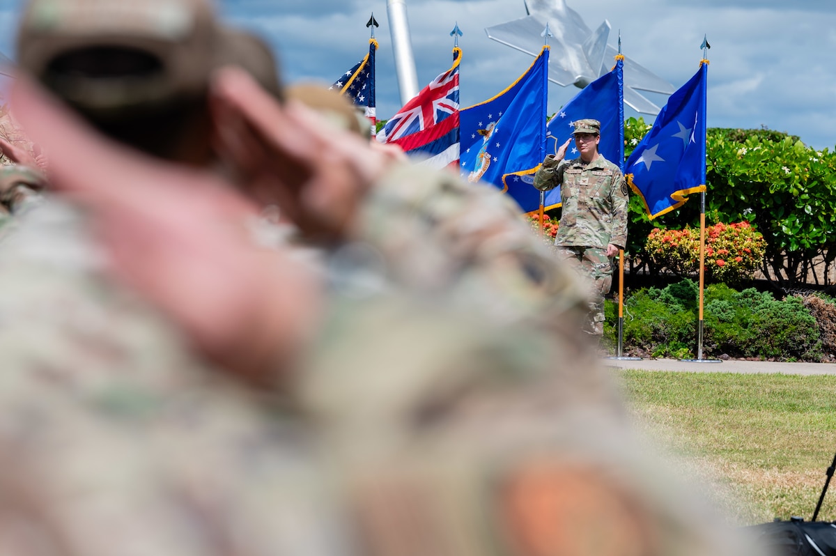 Col. Julie Sposito Salceies, 613th Air Operations Center incoming commander, renders her first salute as the new commander of the 613th AOC on Joint Base Pearl Harbor-Hickam, Hawaii, June 26, 2024. The 613th AOC supports operations across the Indo-Asia-Pacific region by integrating air, space, cyber and information operations. (U.S. Air Force photo by Senior Airman Mark Sulaica)