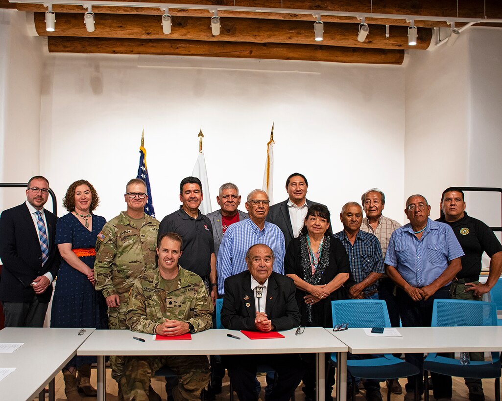 Michael Connor, Assistant Secretary of the Army (Civil Works), (back row fourth from left), and Col. James Handura, (back row third from left), commander, USACE-South Pacific Division, join Lt. Col. Jerre Hansbrough, commander, USACE-Albuquerque District, (front left), and Max Zuni, governor, Pueblo of Isleta, (front right), and representatives from the Albuquerque District and the Pueblo of Isleta, including several council members, after the signing of a partnership agreement at the Pueblo of Isleta Cultural Center, June 26, 2024. The agreement will begin a comprehensive study of erosion at the Pottery Mound site and evaluate what solutions can be put in place to protect the site which is of historic and cultural significance to the Pueblo.