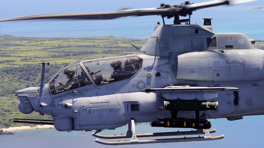 U.S. Marine Corps Capt. Peter Larsen, left, and Capt. Charles Tuan, both AH-1Z attack helicopter pilots with Marine Medium Tiltrotor Squadron 262 (Rein.), 31st Marine Expeditionary Unit, fly with an AGM-179 joint air-to-ground munition (JAGM) during an expeditionary (EXPO) strike, off the coast of Okinawa, Japan, June 26, 2024. This EXPO strike launched the first JAGM off an AH-1Z in the Indo-Pacific region. The JAGM provides a true “fire and forget” capability to guide the missile to endgame, able to destroy fast-moving maritime targets like fast attack craft (FAC) in rough sea states. The 31st MEU, the Marine Corps’ only continuously forward-deployed MEU, provides a flexible and lethal force, ready to perform a wide range of military operations as the premiere crisis response force in the Indo-Pacific region. Larsen and Tuan are natives of California. (U.S. Marine Corps photo by Cpl. Christopher Lape)