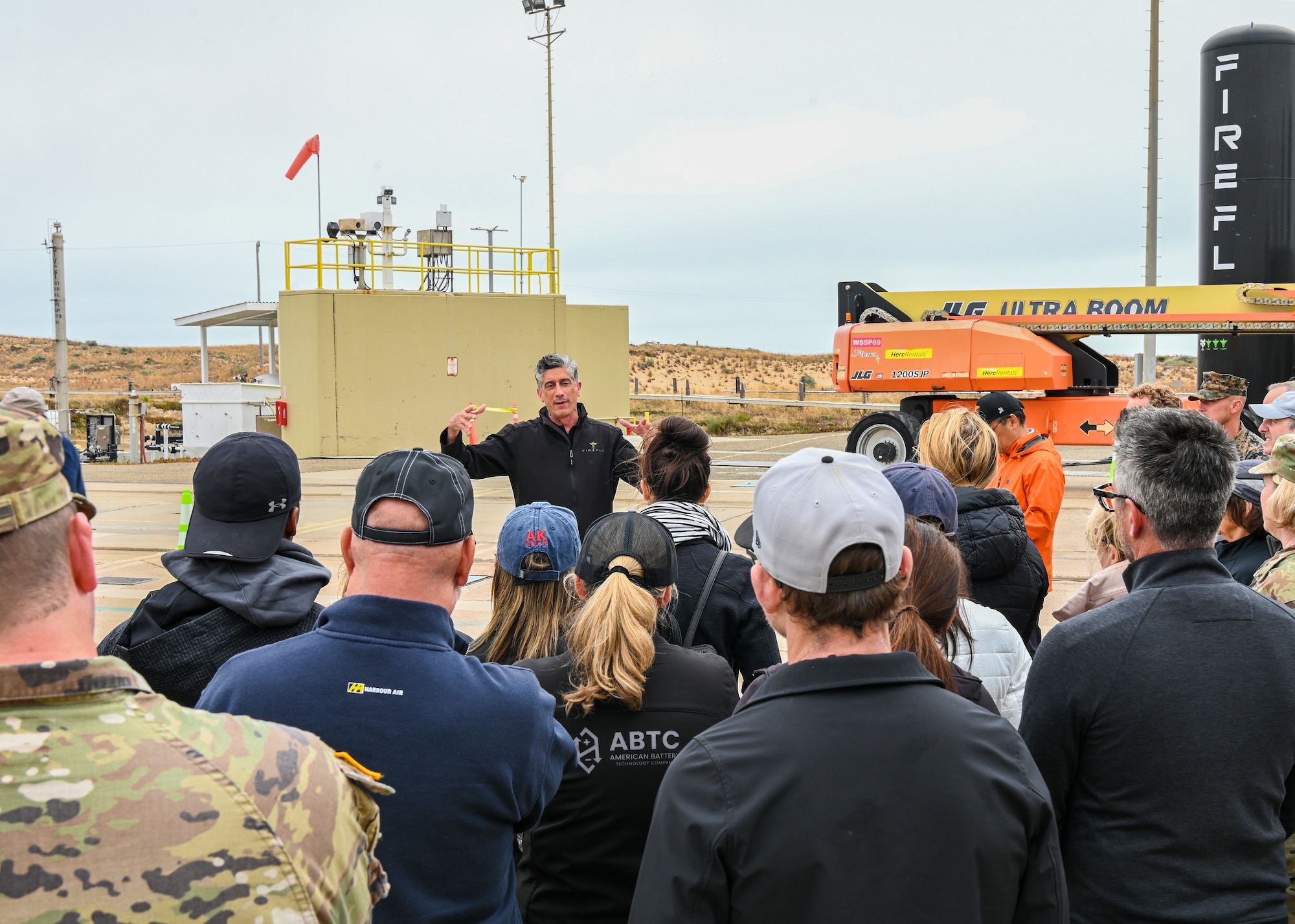 A Firefly site lead explains launch capabilities to the participants of the Joint Civilian Orientation Conference (JCOC) at Vandenberg Space Force Base.