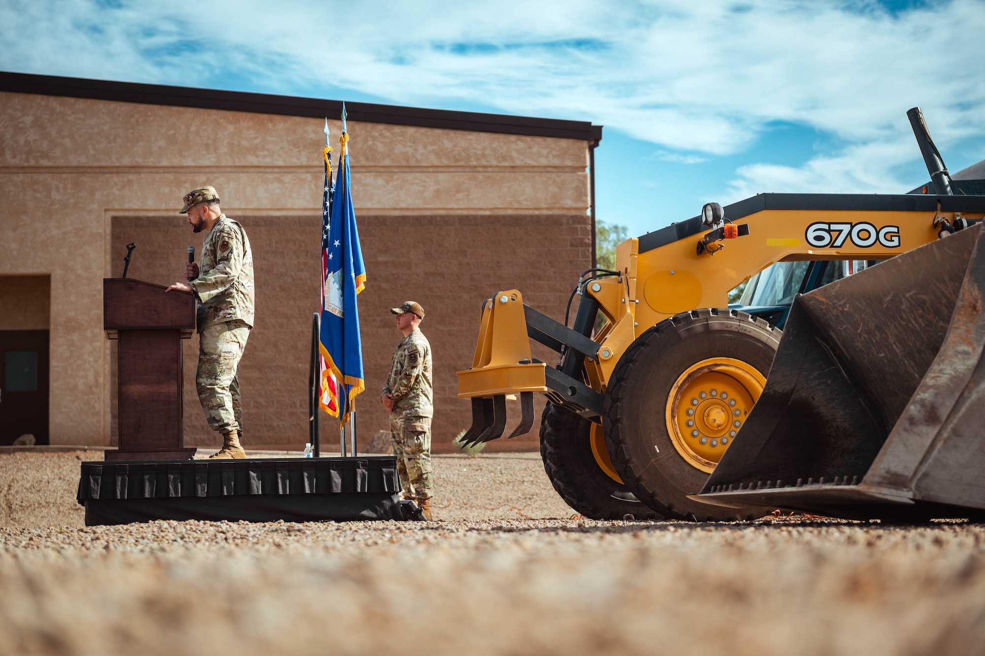 U.S. Air Force Tech. Sgt. Jacorey Burbank, Luke Air Force Base Honor Guard noncommissioned officer in charge, speaks during a groundbreaking ceremony for the new Honor Guard facility.