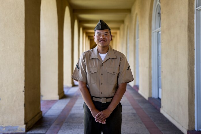 U.S. Marine Corps Pfc. Jiang Xinnian, a native of China and recruited from Pasadena, Calif. with Echo Company, 2nd Recruit Training Battalion, poses for a photo after a naturalization ceremony at Marine Corps Recruit Depot, San Diego, June 27, 2024. The naturalization ceremony took place during family day to recognize Marines who became United States citizens by completing bootcamp. (U.S. Marine Corps photo by Sgt. Yvonna Guyette)