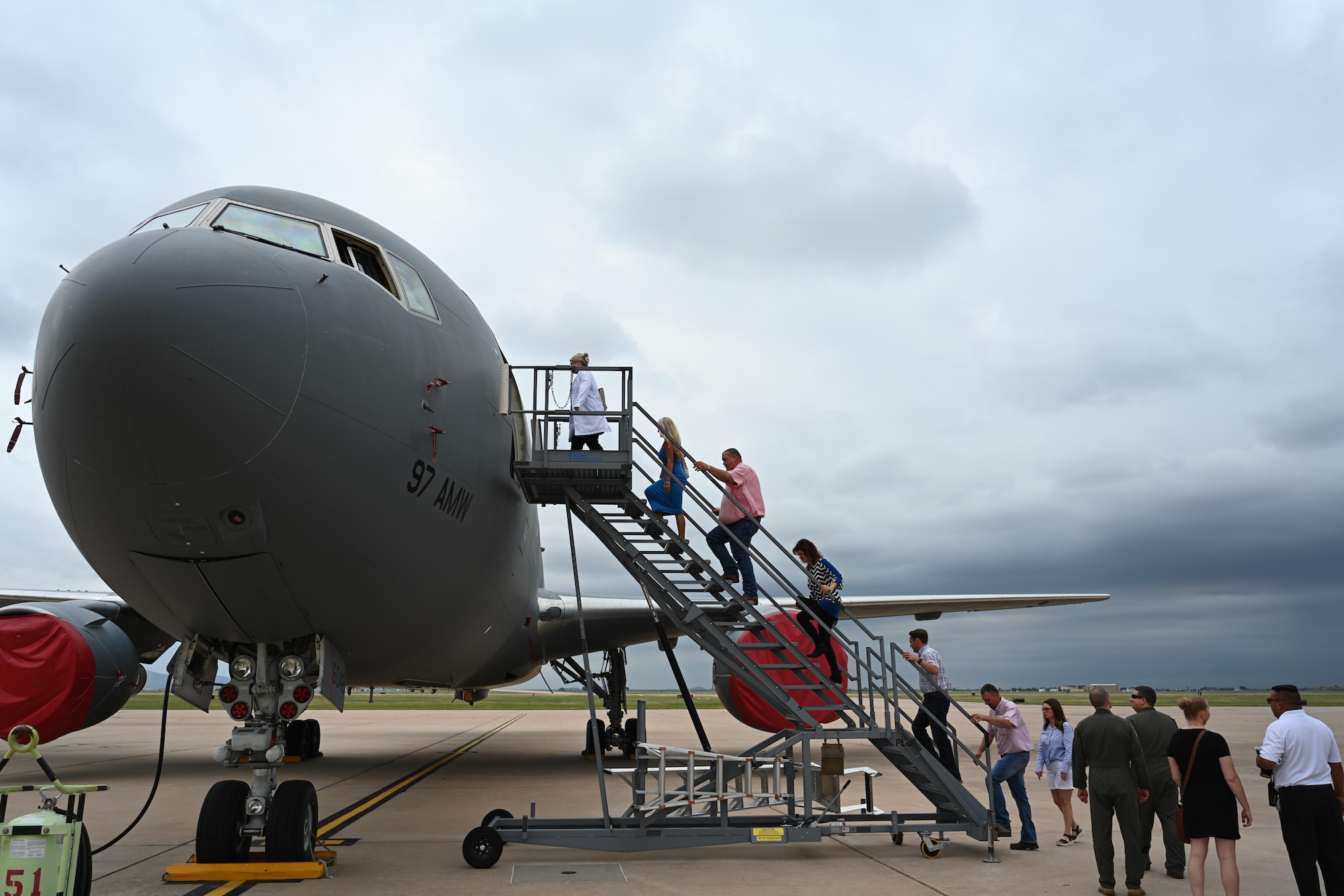 Altus Air Force Base (AFB) Airmen and honorary commanders board a KC-46 Pegasus aircraft on the flightline of Altus AFB, Oklahoma, June 11, 2024. The KC-46 is able to takeoff at gross weights up to 415,000 pounds. (U.S. Air Force photo by Airman 1st Class Jonah G. Bliss)