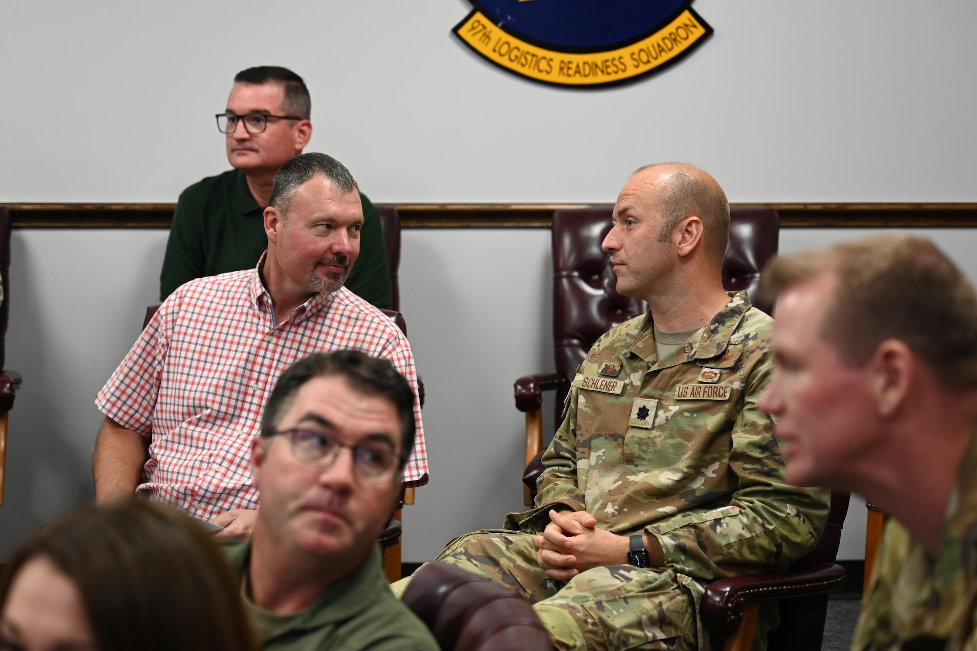 Brad Seaton, 97th Operational Support Squadron (OSS) honorary commander, left, chats with U.S. Air Force Lt. Col. Christopher Shclener, 97th OSS commander, right, at Altus Air Force Base, Oklahoma, June 11, 2024. Schlener recently assumed command and this was his first time meeting his honorary commander. (U.S. Air Force photo by Airman 1st Class Jonah G. Bliss)