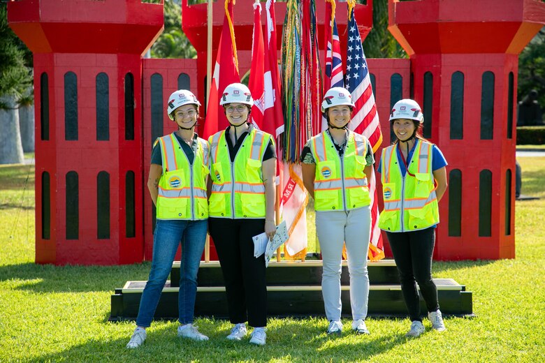 Department of the Army Fellows Sarah Wetsch, Franca Daenzer, Malia Hines, and Ikumi Utashiro pose for a photo during a ceremony to present the prestigious Army Safety and Occupational Health Star Award to the Honolulu District, U.S. Army Corps of Engineers on Fort Shafter June 28, 2024. They served as ushers during the ceremony while wearing newly issued safety helmets and vests.