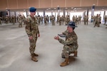 Tech. Sgt. Brian Weber, a Military Training Instructor with the 321st Training Squadron, provides guidance to U.S. Air Force Academy Cadet 2nd Class Seth Hannenburg during a weapons handling lesson for Basic Military Training trainees on June 17, 2024, at Joint Base San Antonio-Lackland, Texas. The Summer Leadership Program at USAFA provides cadets with the opportunity to collaborate with BMT MTIs at the 737th Training Group for three weeks in June. When the cadets return to USAFA in the fall, they will lead the six-week indoctrination program, Basic Cadet Training, for incoming USAFA students. The 321 TRS, is just one of 10 training squadrons, that guide and coach the next generation of Airmen at BMT. (U.S. Air Force photo by Ava Leone)