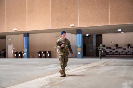 U.S. Air Force Academy Cadet 2nd Class Seth Hannenburg prepares to lead a weapons handling lesson alongside Military Training Instructors for Basic Military Training trainees with the 321st Training Squadron on June 17, 2024, at Joint Base San Antonio-Lackland, Texas. The Summer Leadership Program at USAFA provides cadets with the opportunity to collaborate with BMT MTIs at the 737th Training Group for three weeks in June. When cadets return to USAFA in the fall, they will lead the six-week indoctrination program, Basic Cadet Training, for incoming USAFA students. The 321 TRS is just one of 10 training squadrons that guide and coach the next generation of Airmen at BMT. (U.S. Air Force photo by Ava Leone)