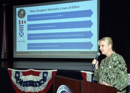 JOINT BASE SAN ANTONIO-FORT SAM HOUSTON – (June 27, 2024) – Commanding Officer Capt. Jennifer Buechel (Nurse Corps), Naval Medical Research Unit (NAMRU) San Antonio, spoke on the command’s support of the Navy Surgeon General’s Four Lines of Effort during an All Hands meeting held at the Military and Family Readiness Center.  NAMRU San Antonio’s mission is to conduct gap driven combat casualty care, craniofacial, and directed energy research to improve survival, operational readiness, and safety of Department of Defense (DoD) personnel engaged in routine and expeditionary operations. It is one of the leading research and development laboratories for the U.S. Navy under the DoD and is one of eight subordinate research commands in the global network of laboratories operating under the Naval Medical Research Command in Silver Spring, Md. (U.S. Navy photo by Burrell Parmer, NAMRU San Antonio Public Affairs/Released)